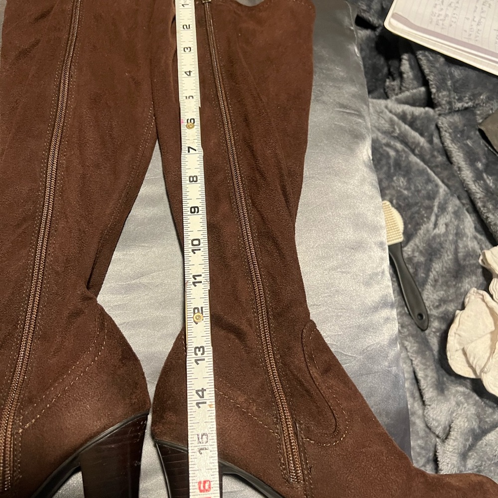 Brown stretchy high heeled knee high boots